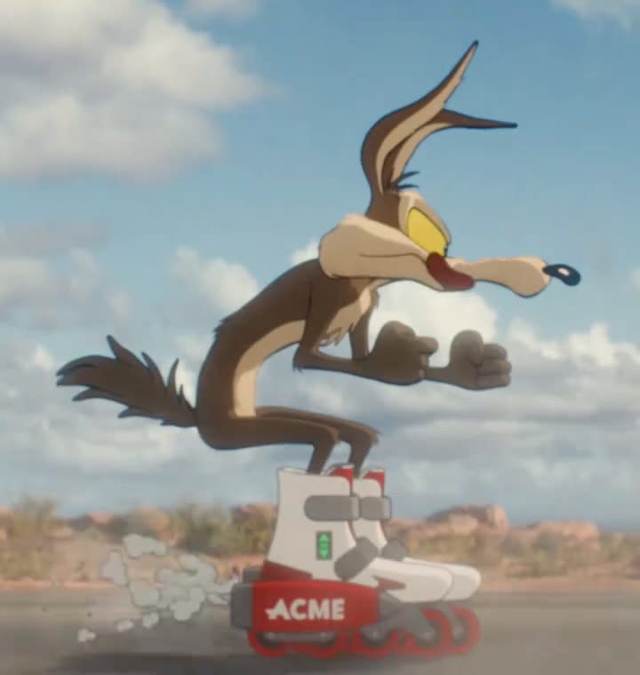 Wile E. Coyote races down a desert road on a pair of red and
                  white ACME rocket skates.